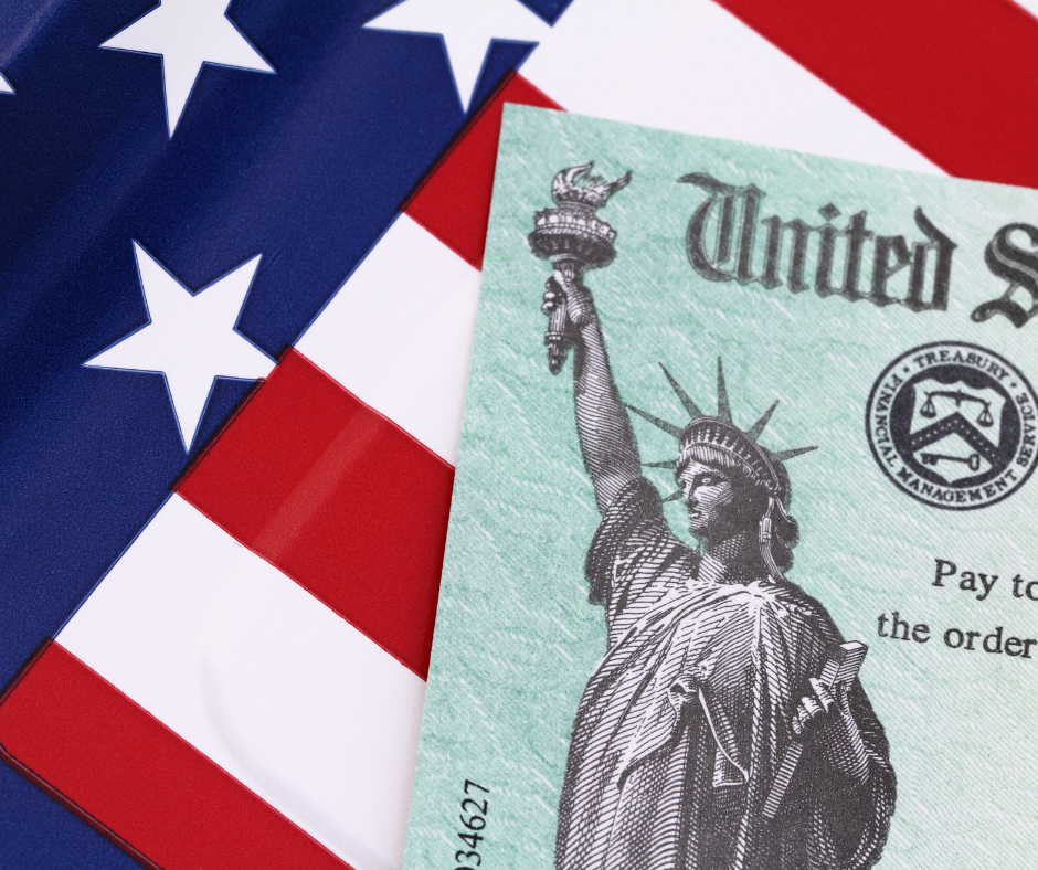 U.S. flag beneath a check featuring the Statue of Liberty